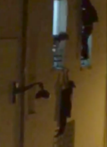 Fleeing the horror of the terrorist attack on the Bataclan concert venue, a pregnant woman clings perilously to a window ledge.